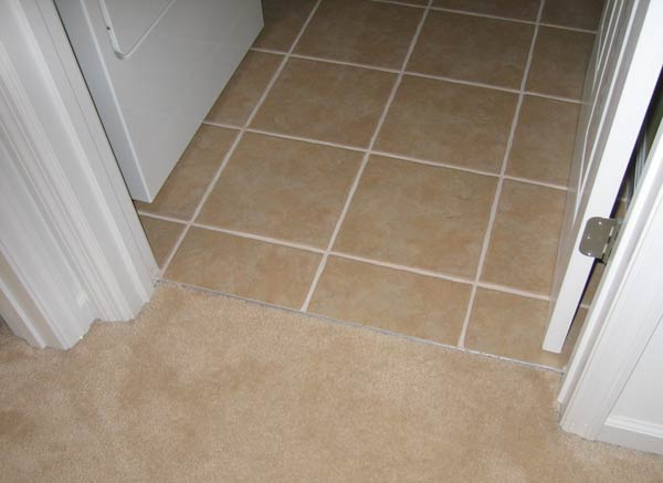 The carpet put back into place with new tack strip.